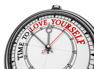 clock with words "time to love yourself"